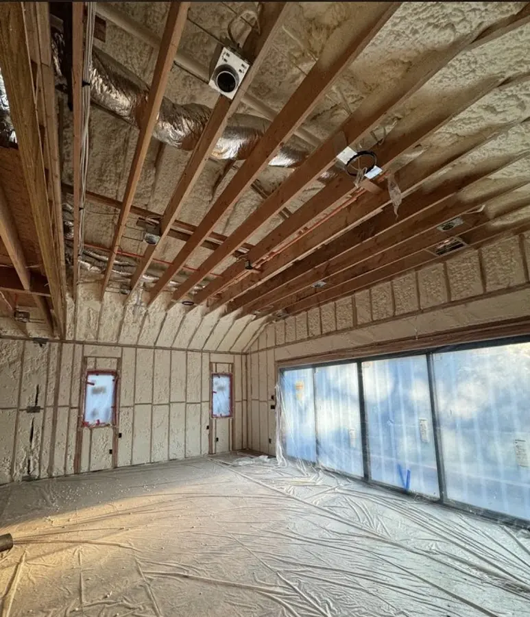 Interior walls and ceiling insulated with spray foam during new construction in Halfmoon